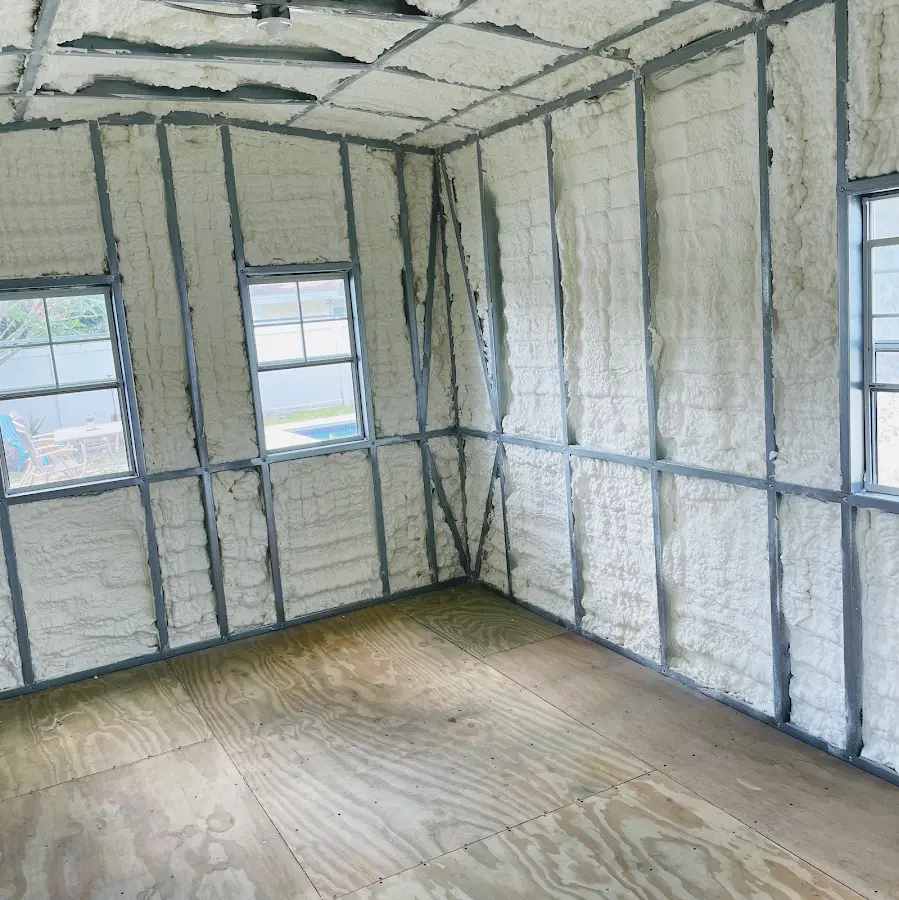 Closed-cell spray foam insulation applied to wall cavities in a residential project in Adrian